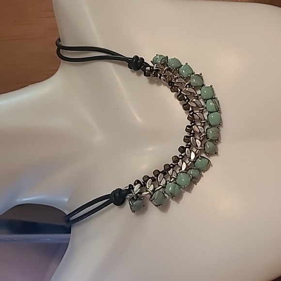 Fossil necklace with green stones and silver color. - Picture 1 of 6